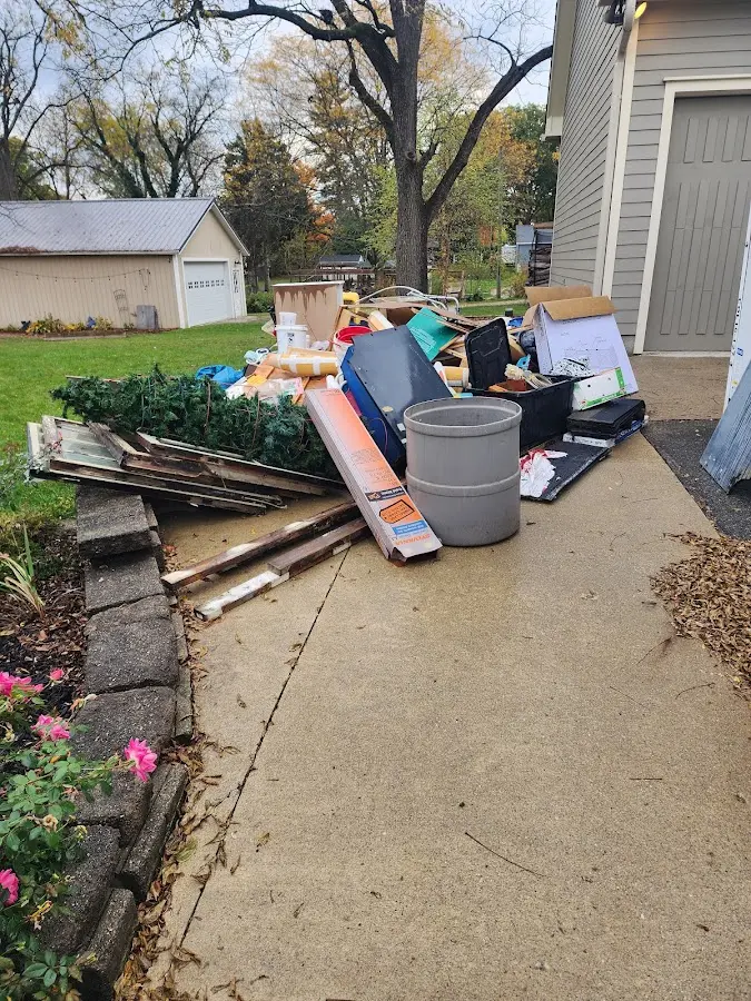 Dumpster being loaded with debris for 3 Yard Dumpster Rental in Battlement Mesa